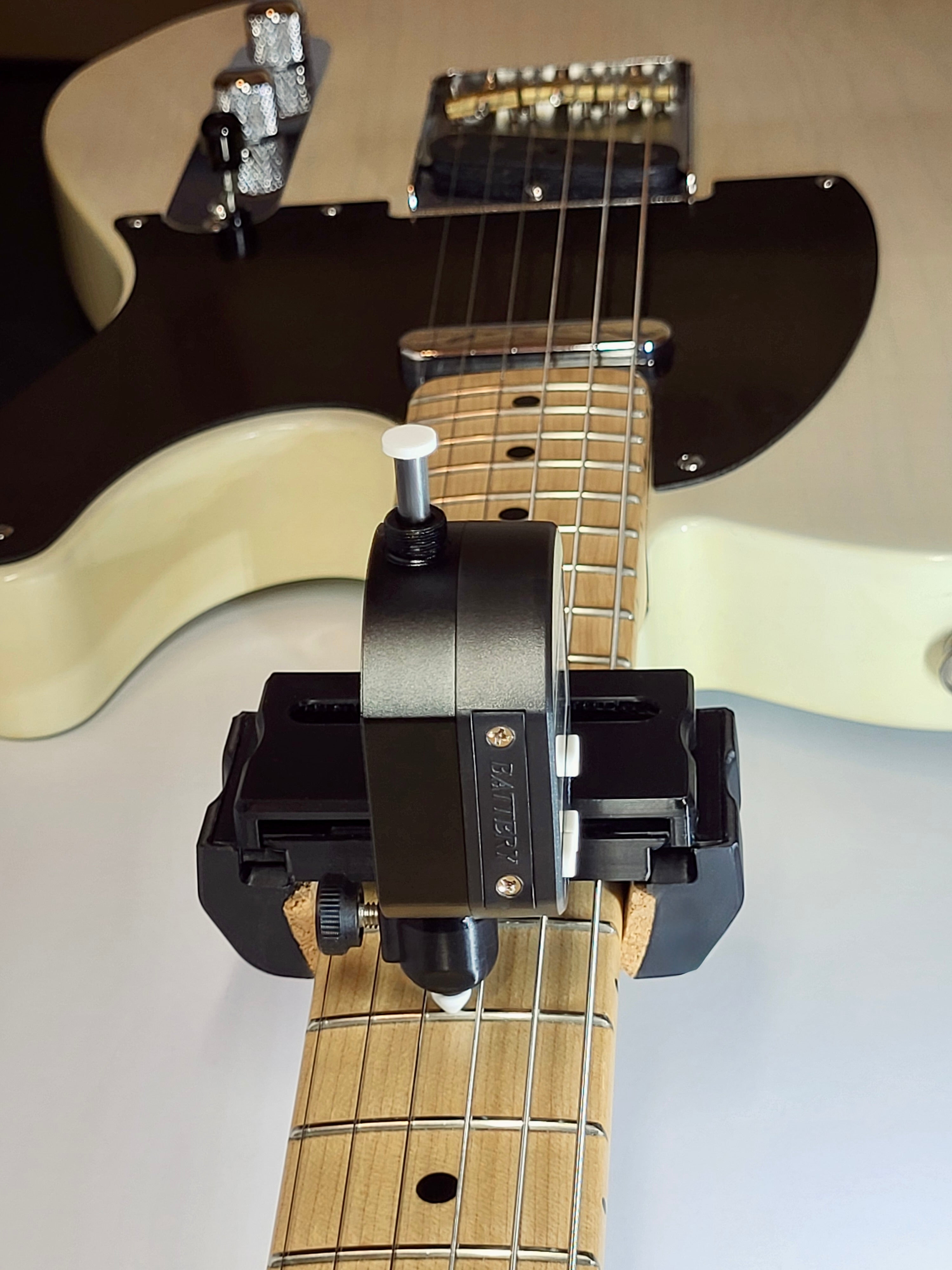 DL Action Finder - sideview on a guitar's neck